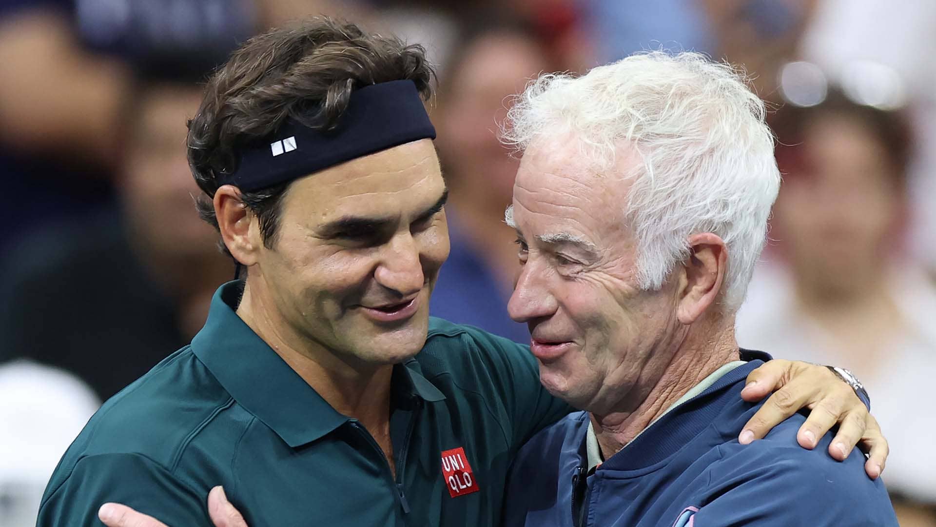 Roger Federer and John McEnroe on Tuesday at the US Open.